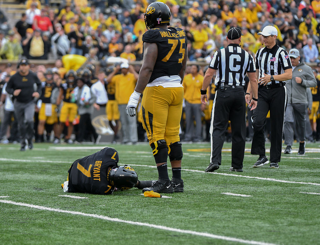 Missouri QB Kelly Bryant lies hurt on the ground after taking a big hit